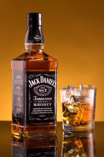 Jack Daniels bottle and tumbler with ice