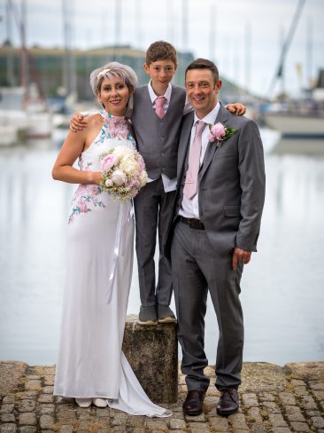 Bride and groom on harbour side
